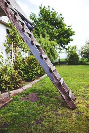 Ladder leaning against house